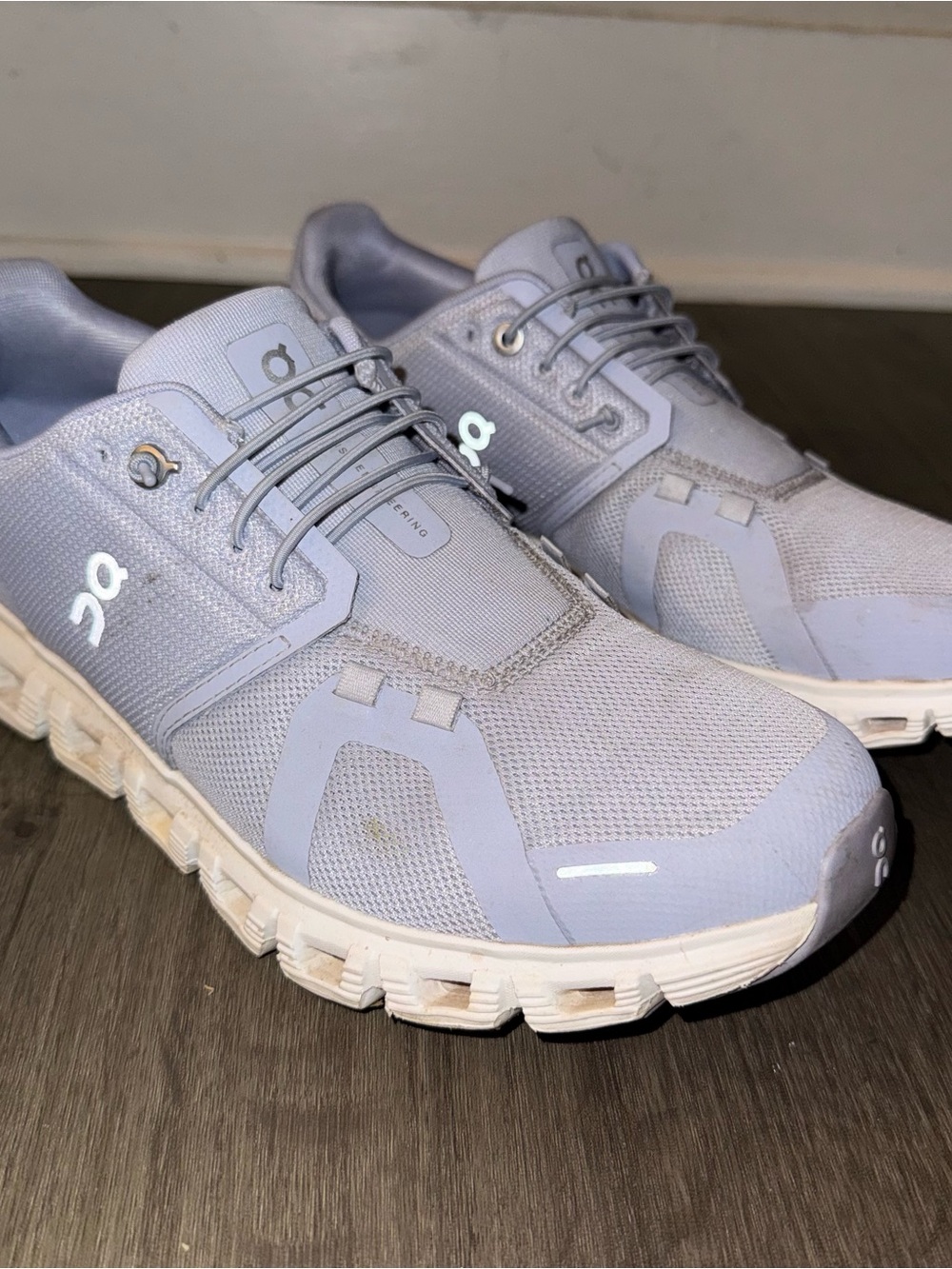 On Running woman’s Athletic Shoes in purple and white